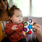 Baby Einstein jucarie senzoriala Curiosity Clutch Twist & Pop Rattle Teether 3m+
