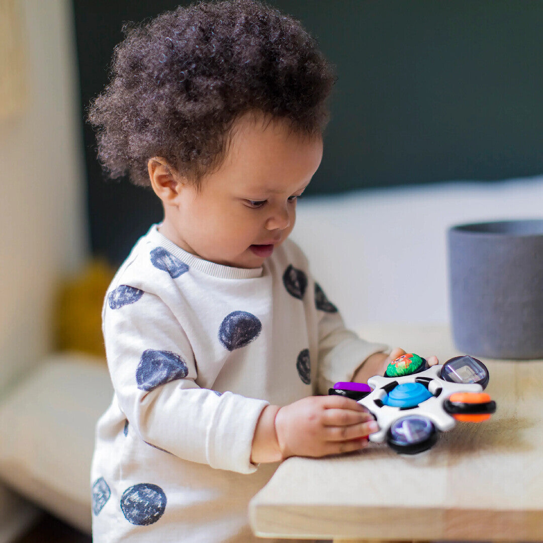 Baby Einstein jucarie senzoriala Curiosity Clutch Twist & Pop Rattle Teether 3m+