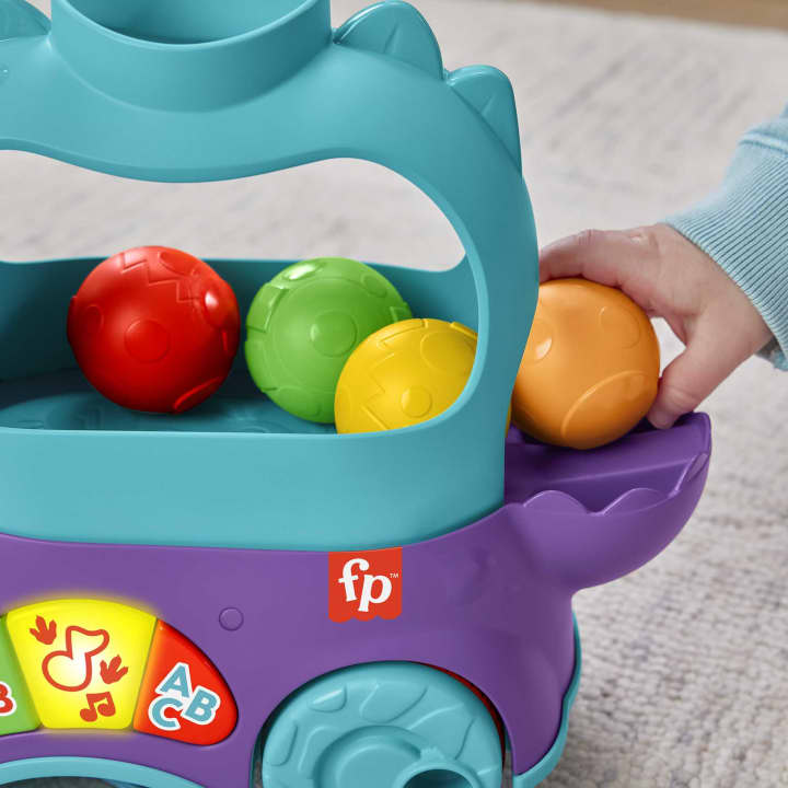 Fisher Price jucarie interactiva Prieten Dino cu mingi 12-36 luni