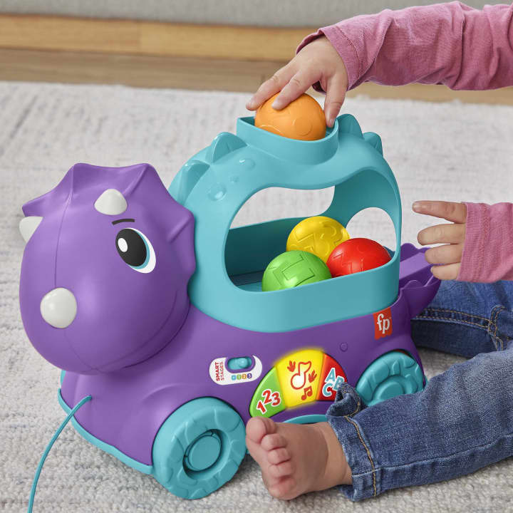 Fisher Price jucarie interactiva Prieten Dino cu mingi 12-36 luni