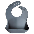 Mushie baveta cu buzunar din silicon 12m+, Tradewinds 01